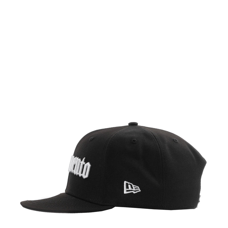 Black baseball cap with white logo patch on front-side