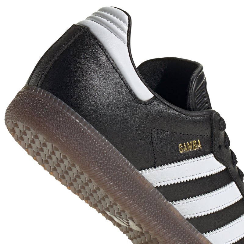 Men's black adidas Samba sneakers, side close-up with white stripes and heel tab