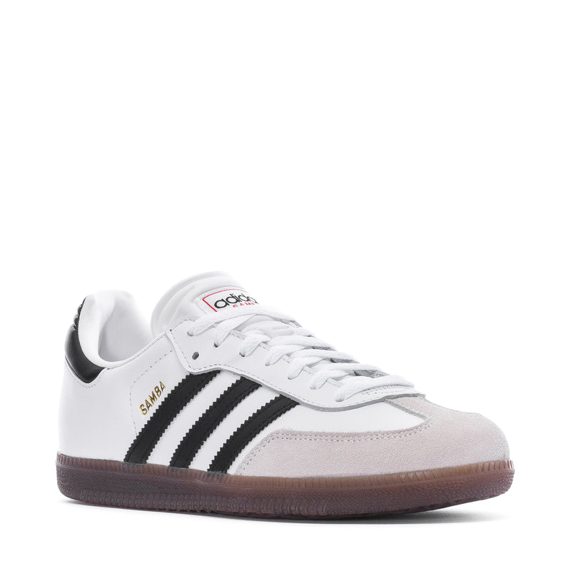 Youth sneakers, white leather with black stripes, lace-up front view, gum sole