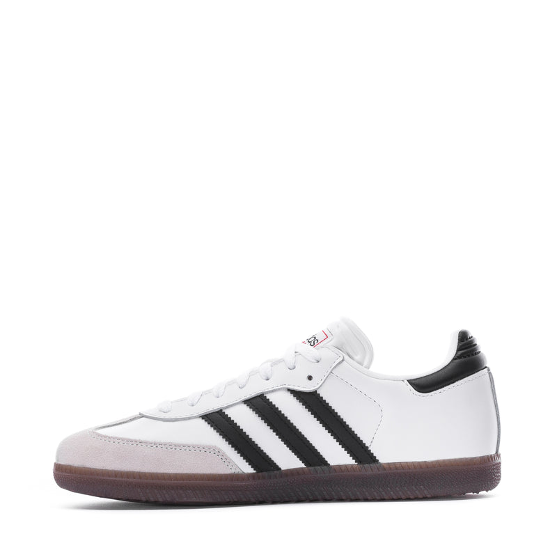 Youth sneakers, white upper with black stripes and low gum outsole, lace-up
