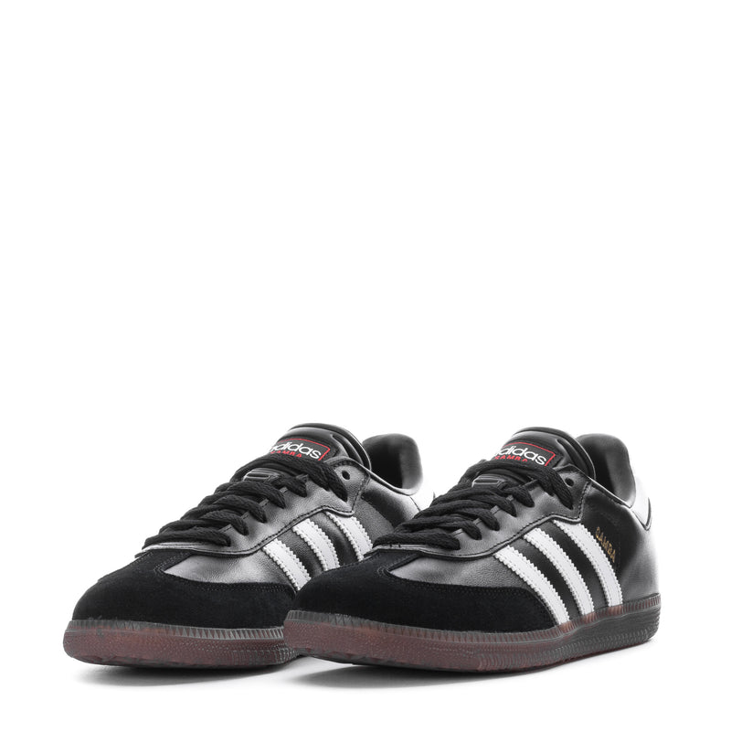 Youth adidas sneakers, black with white stripes and gum outsole (pair view)