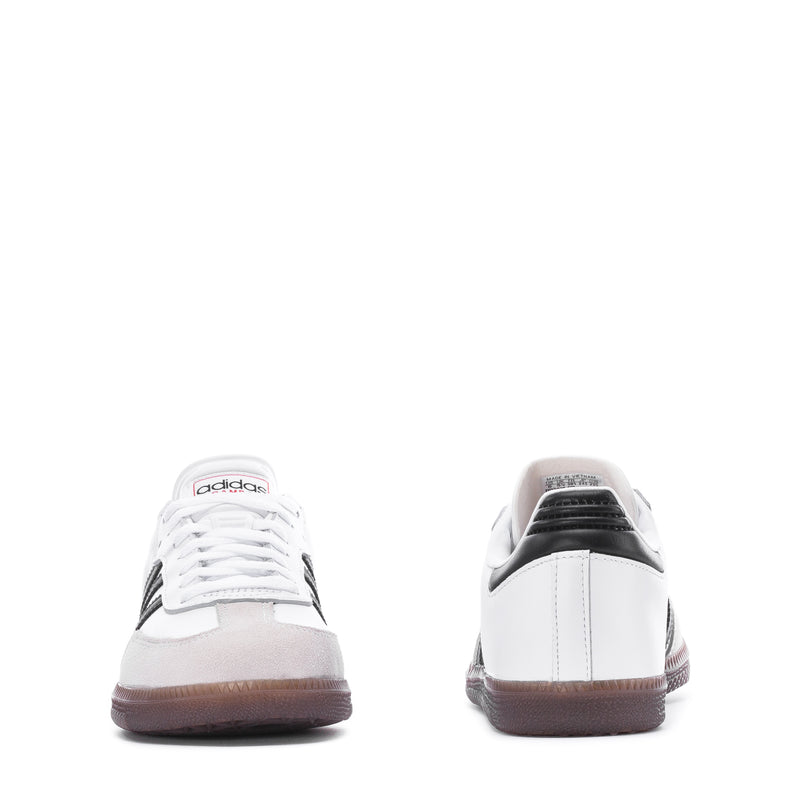 Youth sneakers back view, white leather with black heel detail, lace-up gum sole
