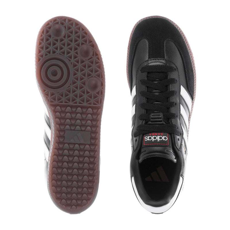 Youth adidas sneakers, outsole tread view and black upper with white stripe