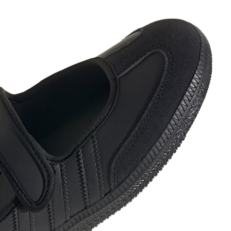 Close-up of black Mary Jane upper with panel seams and padded interior