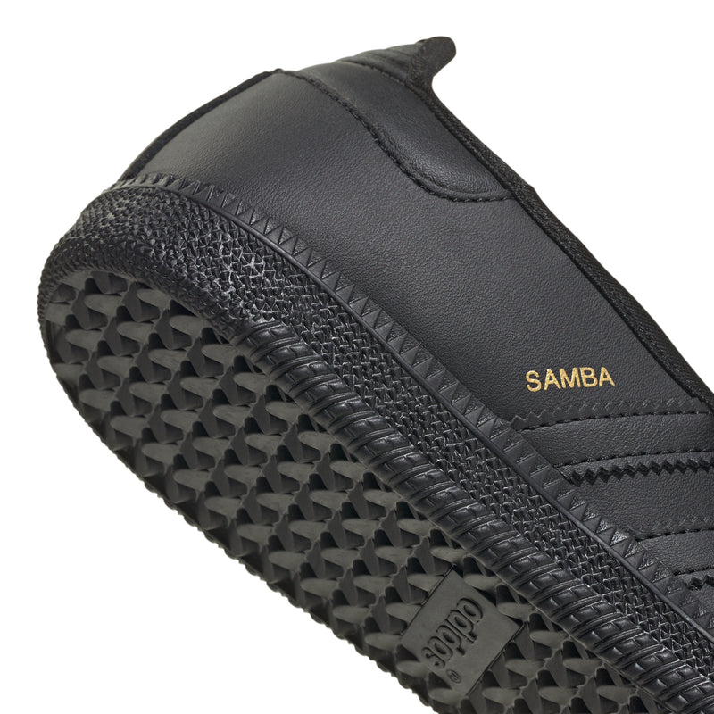 Close-up of black outsole tread with adidas grip texture and Samba label