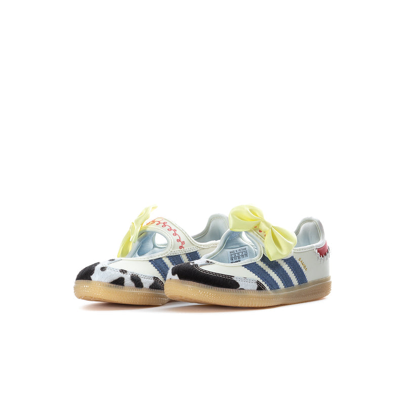 Kids sneakers with white upper, blue three-stripe panels, cow-print toe, yellow bow