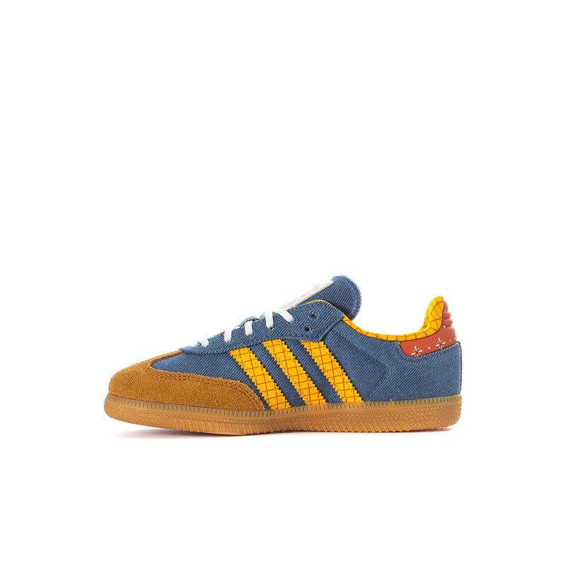 Kids low-top denim blue sneaker with yellow stripes, orange collar detail, gum sole