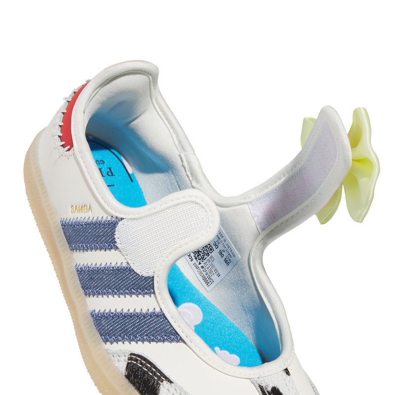 Kids sneakers outer side: white upper, blue stripes, yellow bow, blue lining