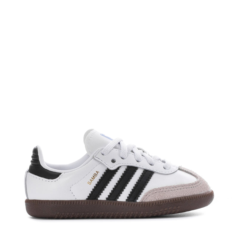 Toddler sneakers with white upper, black three-stripe detail, gum rubber sole.