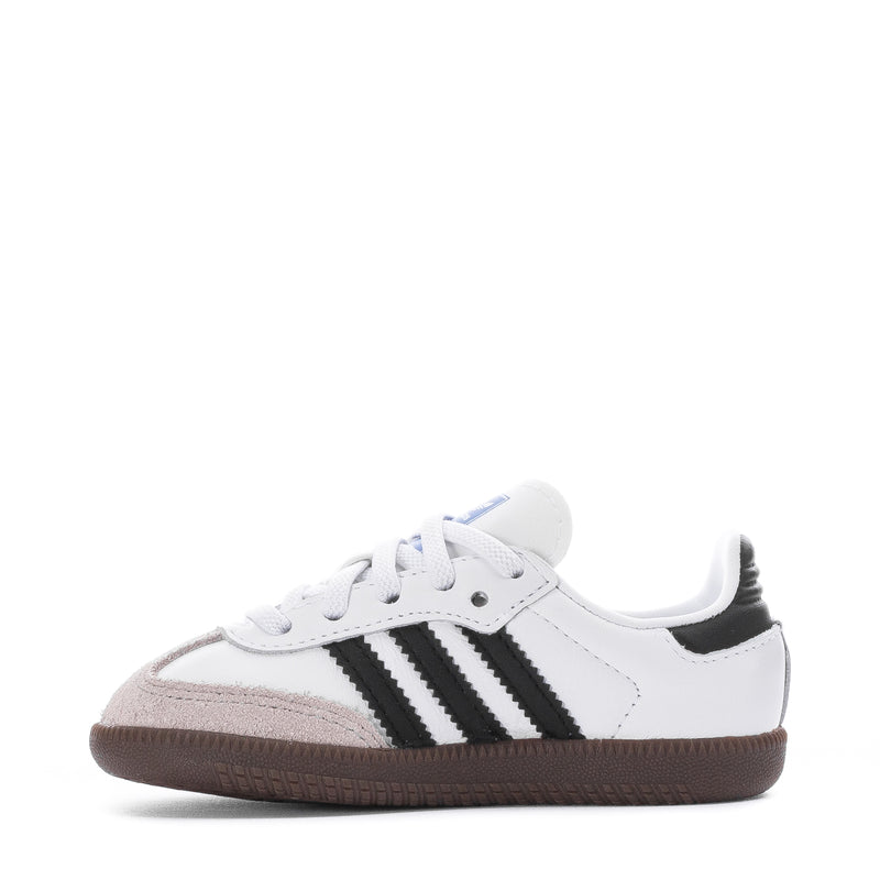 Toddler sneakers, white upper with black three-stripe branding and gum outsole.