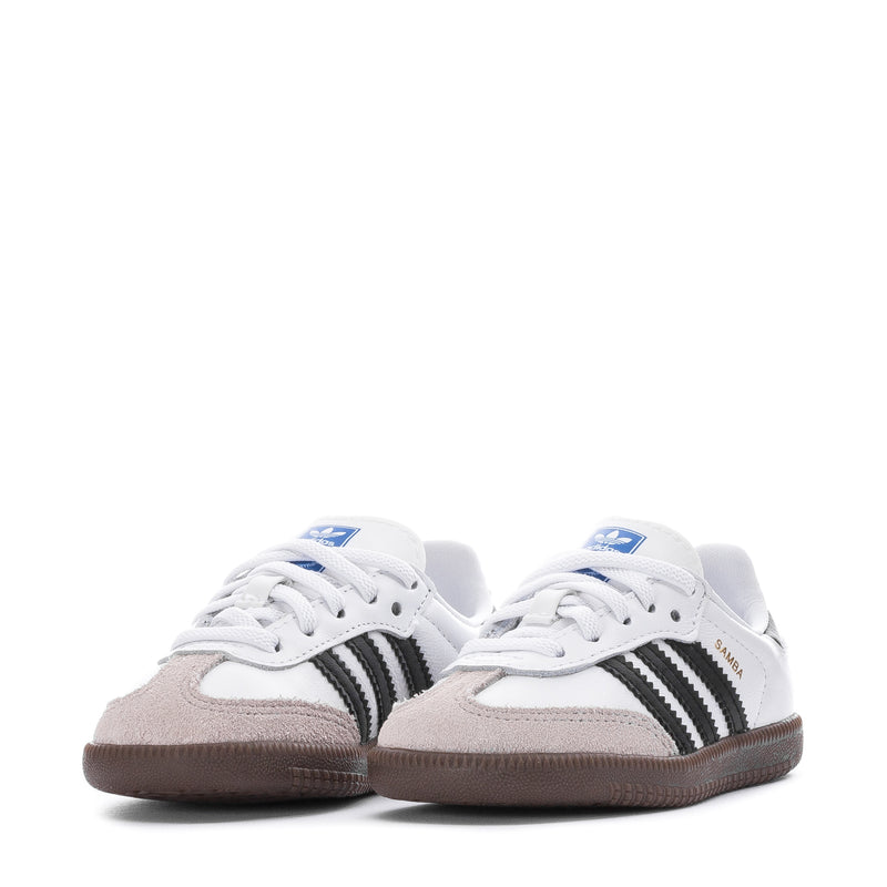 Toddler lace-up sneakers in white with black stripes and gum soles, pair view.