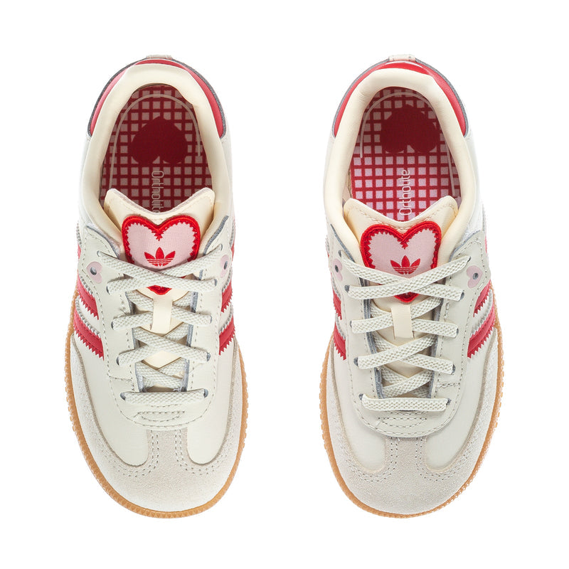 Toddler cream sneakers with red heart trim on collar and plaid insole