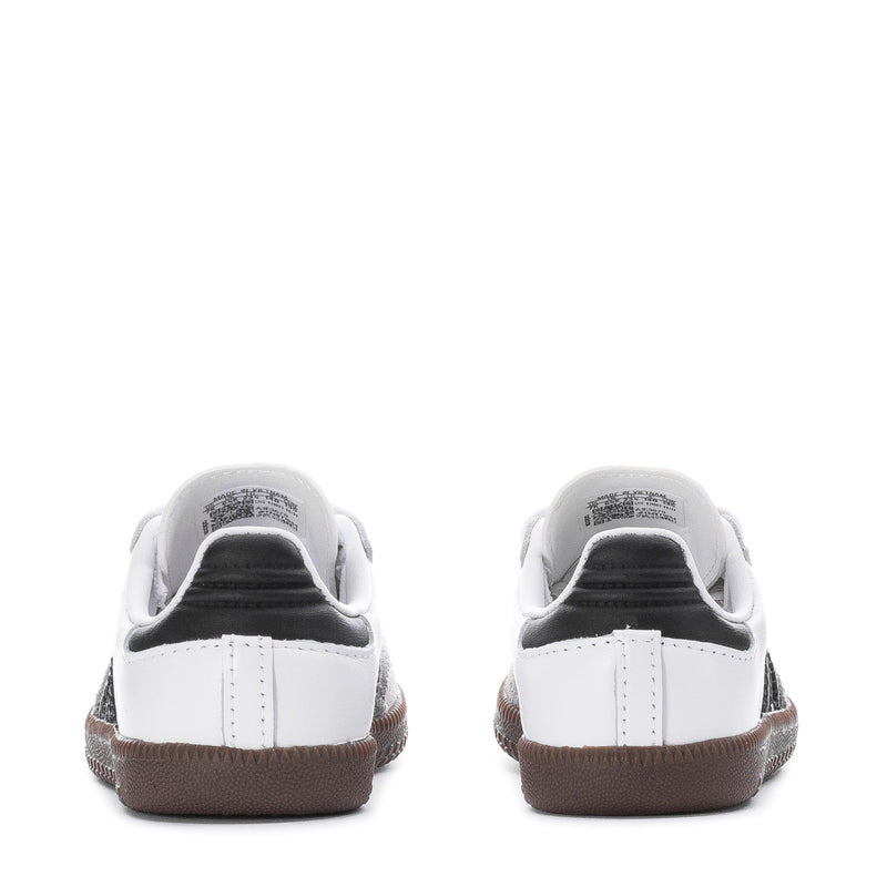 Toddler sneakers with white heel backs, gum trim, and dark lining.