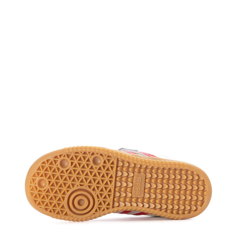 Toddler sneaker outsole with textured gum rubber tread and red details
