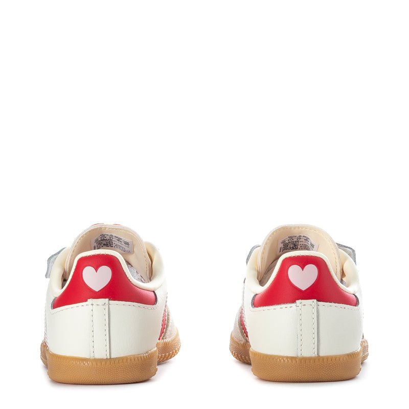 Toddler cream sneakers with gum heel and red heart patch on back