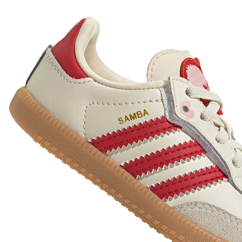 Toddler cream sneakers with red stripes, “SAMBA” label, and gum sole