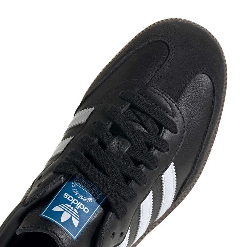Black adidas sneaker upper detail with lace-up front and white stripe panel
