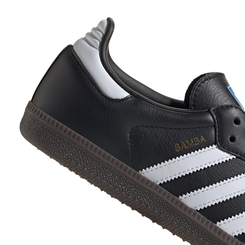 Black adidas sneaker heel with white stripe accent and cushioned collar, side view