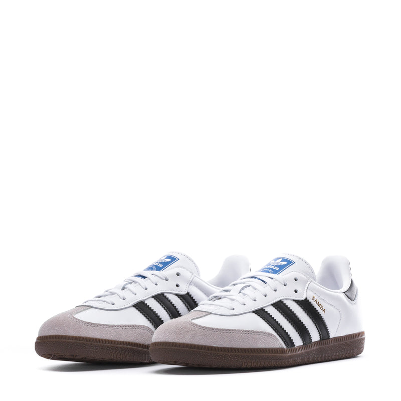 Pair of Samba OG youth sneakers in white with black stripes, brown gum soles
