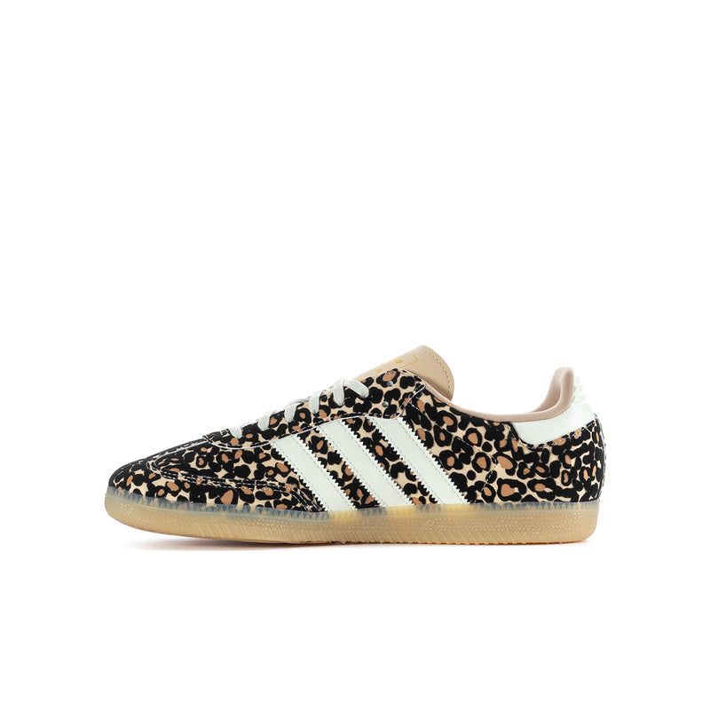 Youth sneaker with side profile: leopard print fabric, white stripes, and tan outsole