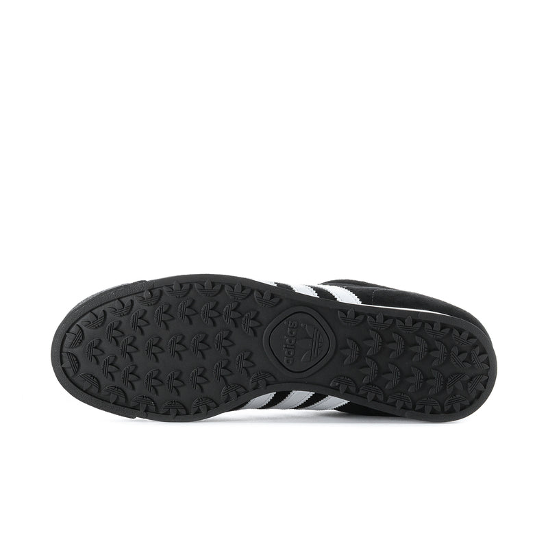 Black textured rubber outsole with adidas logo on underside of sneaker