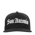 Black baseball cap with white "San Antonio" script logo on front, flat brim