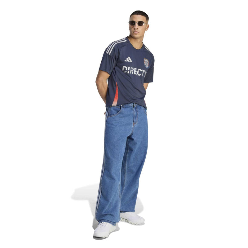 Men's navy replica home soccer jersey on model, showing DIRECTV front and side stripes