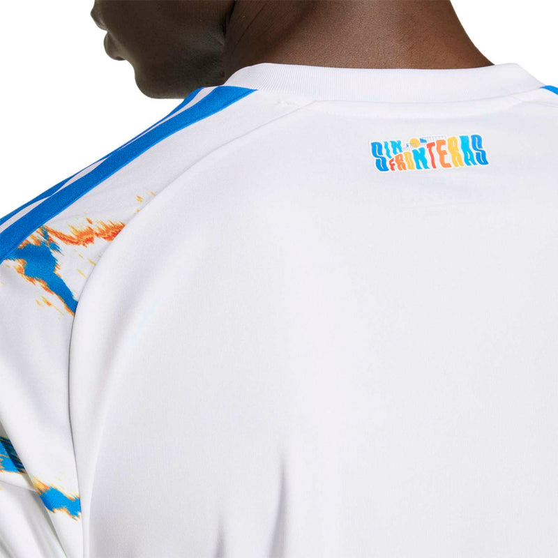 White replica jersey collar with blue shoulder stripe and small back logo