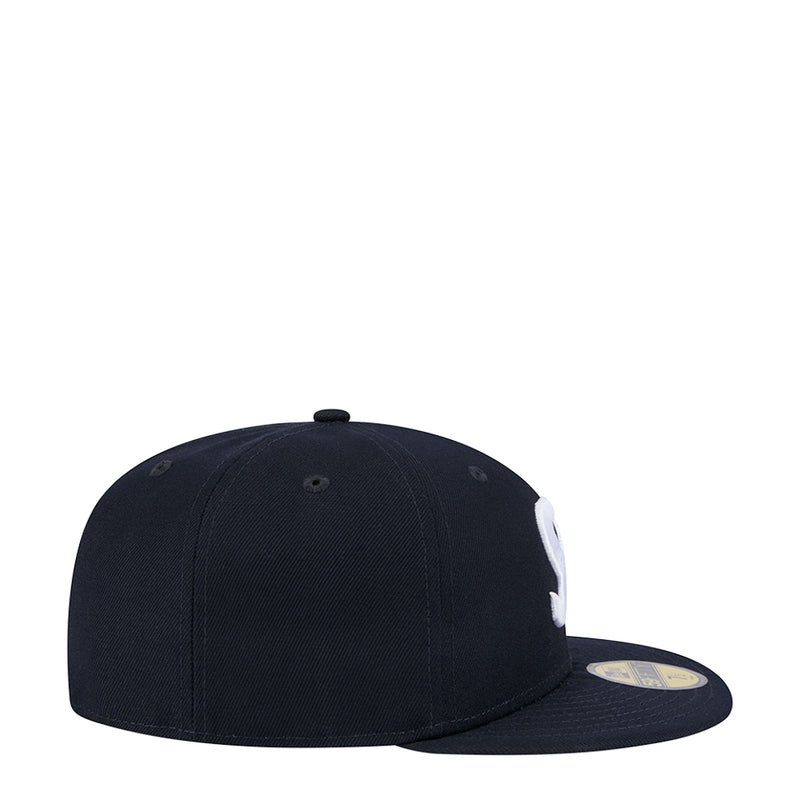 Dark navy snapback cap side view with curved brim