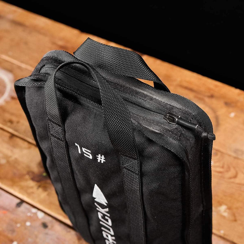The Sand Ruck Plate Bundle is a black zippered bag with handles, labeled "15" and "RUCK" in white letters, perfect for carrying your ruck plate or essential rucking gear.