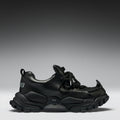 Black sneakers on a gradient gray background