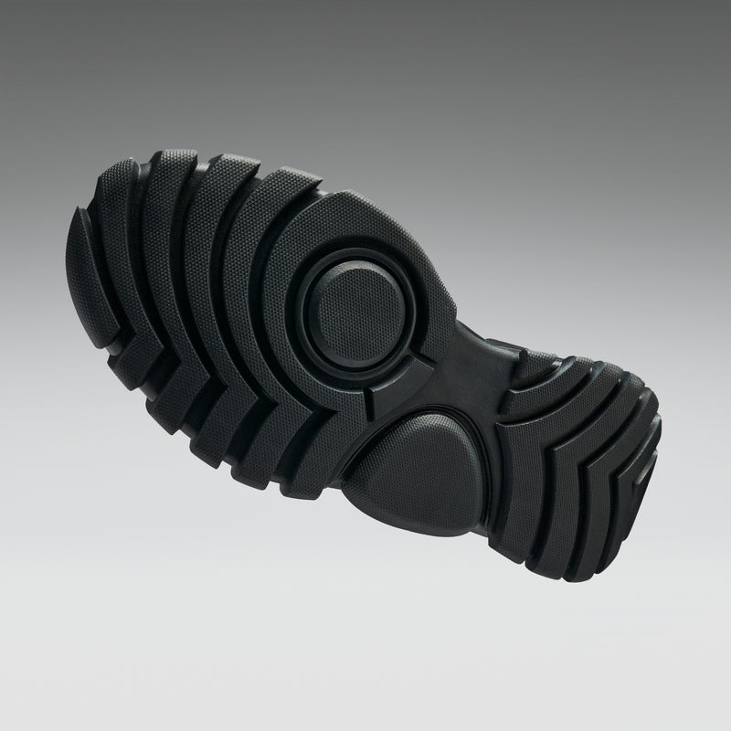 Black sole of a shoe on a gradient gray background