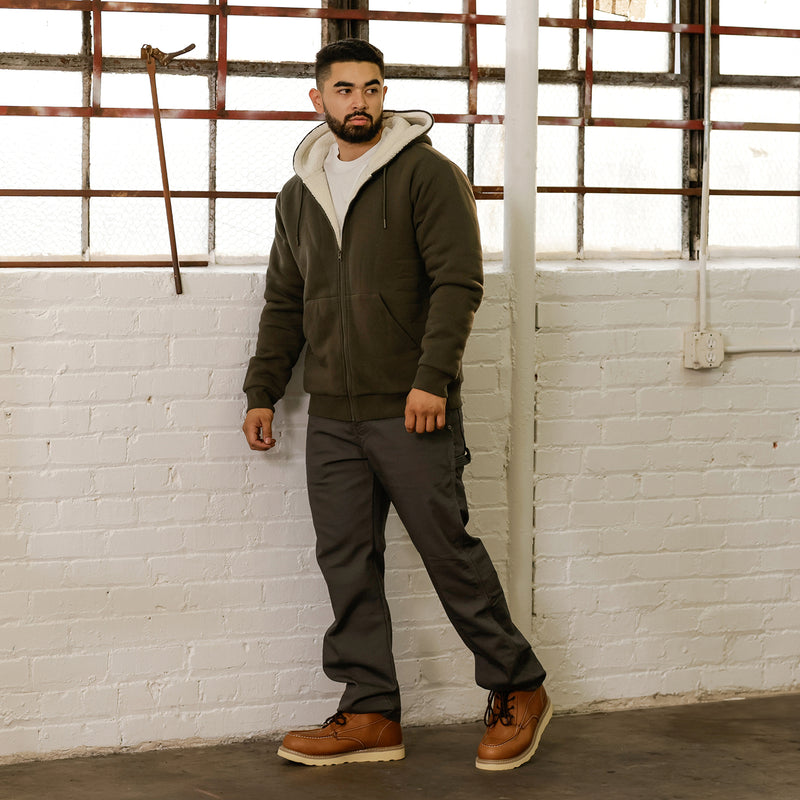 Men's olive sherpa-lined full-zip hoodie on model, front view with zipper