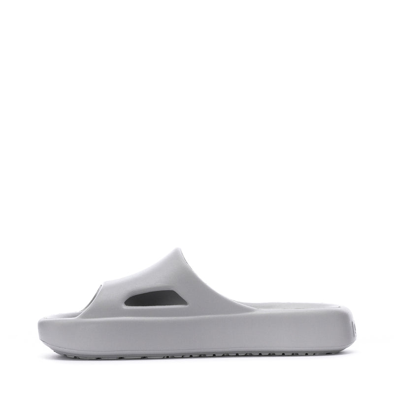 Youth slide sandals in light gray with cutout strap detail and PUMA logo.