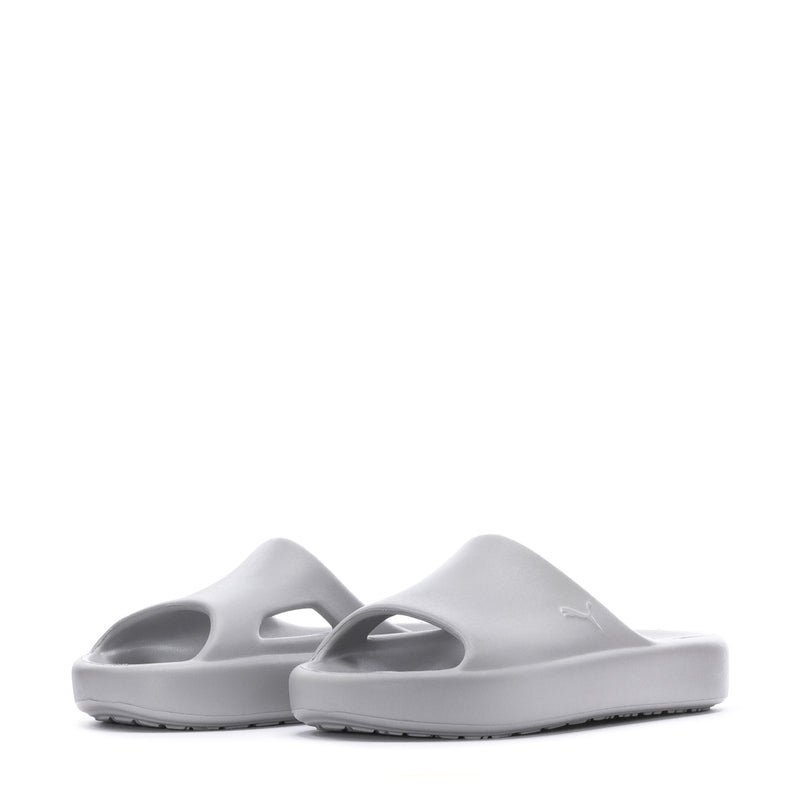 Pair of youth slide sandals in light gray, side view showing two straps.