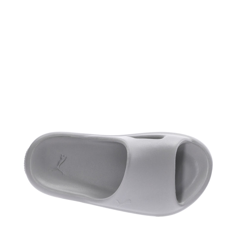 Youth slide sandals in light gray, close-up of inner footbed and PUMA logo.
