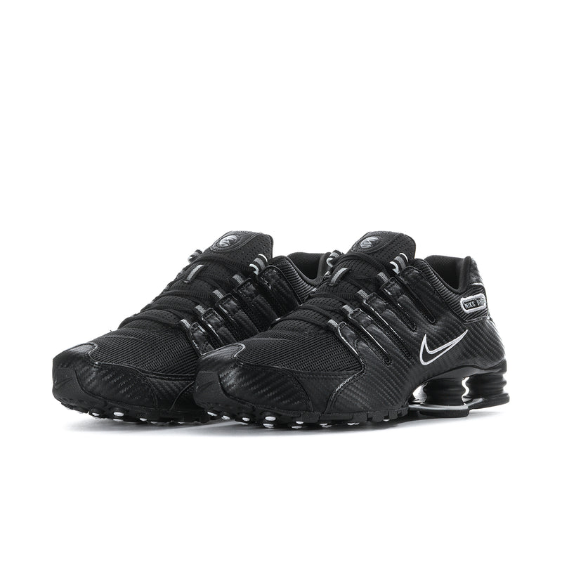 Men's black Nike sneakers, side view, swoosh and Shox-style pods