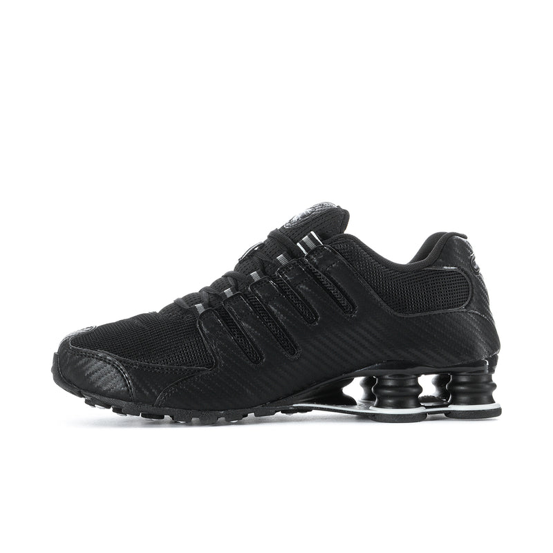 Men's black Nike sneakers with textured upper, lace-up, and Shox-style pods