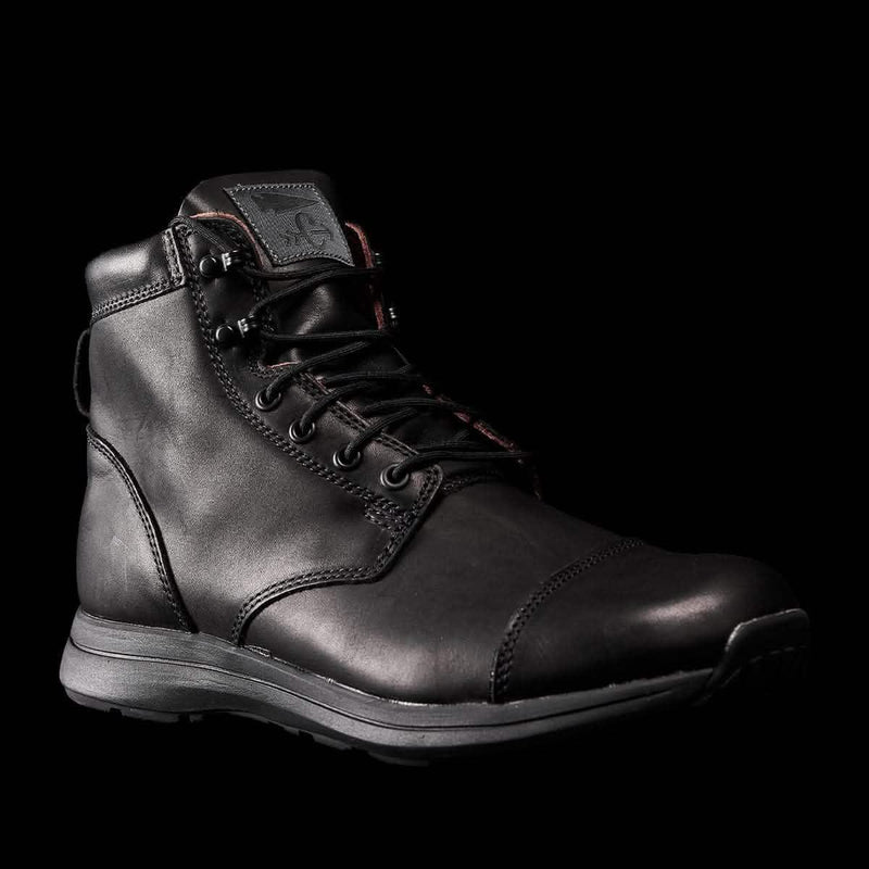 GORUCK durable black leather rucking boot with rugged sole on black background