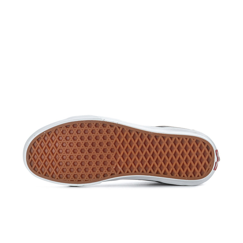 Men's high-top sneaker outsole with brown treaded rubber sole and white sidewall edge