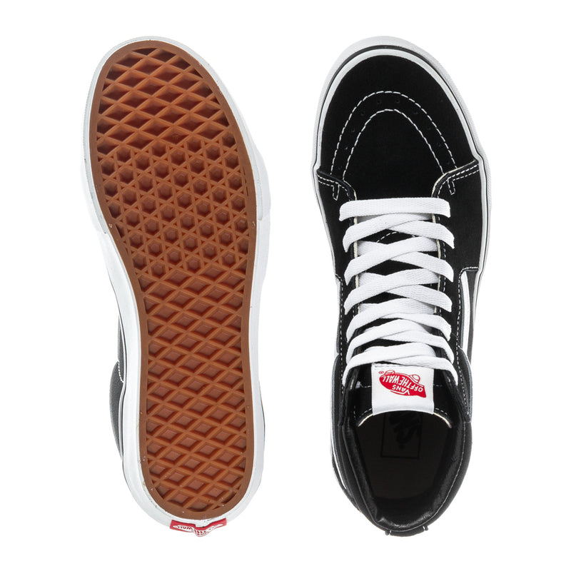 Youth high-top sneaker soles, black uppers with white laces; brown treaded outsole