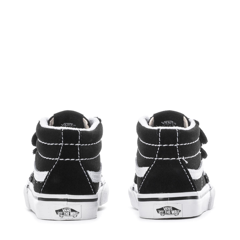 Back view of black toddler mid-top sneakers with white stitching and padded collar