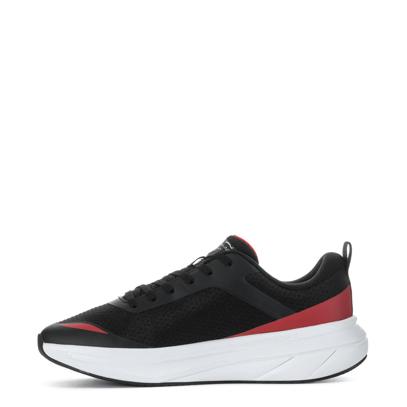 Youth black low-top sneakers with red stripe, white midsole, and lace-up design