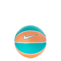 Mini basketball in teal and apricot with white stripe and Nike swoosh logo