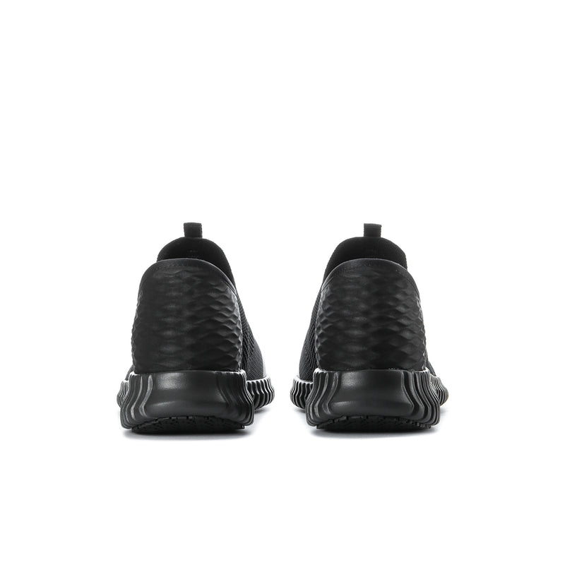Black slip-on sneakers with textured heel detail and flexible back collar