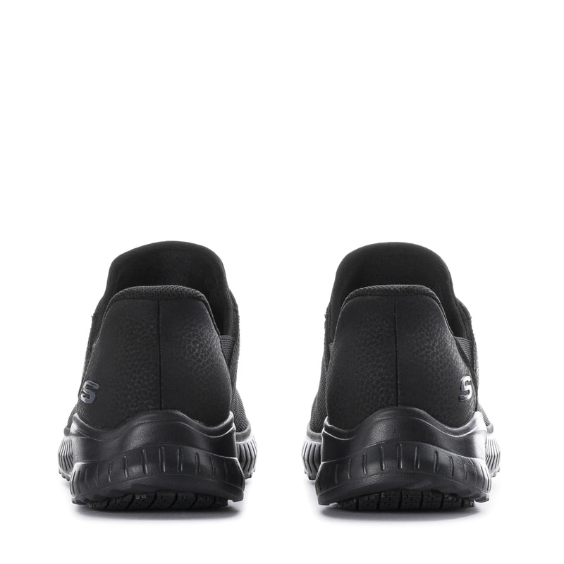 Black sneakers with cushioned heel and chunky treaded sole, rear view