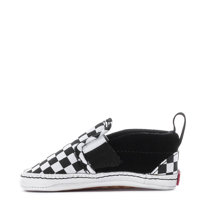 Infant slip-on sneaker showing strap across checkerboard toe and black lining