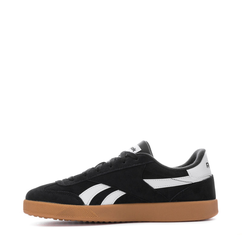 Men's black low-top Reebok sneakers with white side stripes and gum sole