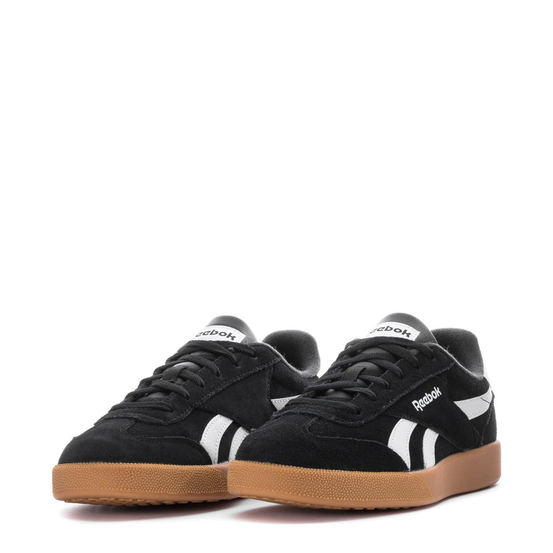 Pair of men's black Reebok sneakers with white stripes and gum bottom
