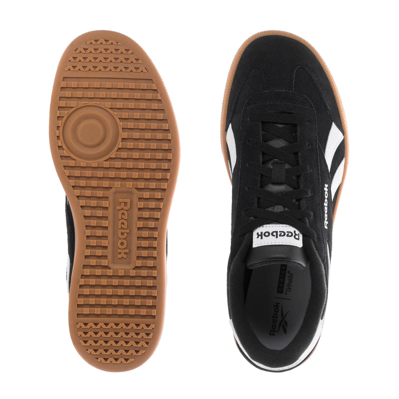 Reebok sneakers: gum tread outsole and black upper with black laces